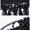 Collier plastron en perles noires à têtes de mort Collier plastron en perles noires à têtes de mort